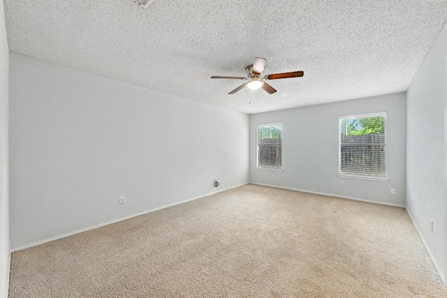 4614 Ganymede Dr, Austin, TX 78727 - spare room with ceiling fan, carpet flooring, and a textured ceiling