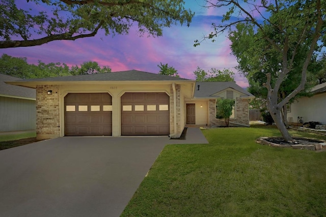 4614 Ganymede Dr, Austin, TX 78727 - ranch-style home featuring a garage, driveway, a yard, and brick siding