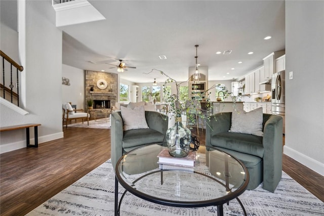 1621 Angolo, New Braunfels, TX 78132 - living room with ceiling fan, a fireplace, dark wood-style floors, recessed lighting, and stairway