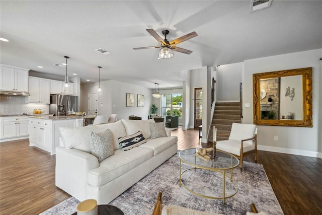 1621 Angolo, New Braunfels, TX 78132 - living area with wood finished floors, ceiling fan, recessed lighting, and stairway