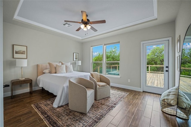 1621 Angolo, New Braunfels, TX 78132 - bedroom with a raised ceiling, access to exterior, dark wood-type flooring, and ceiling fan