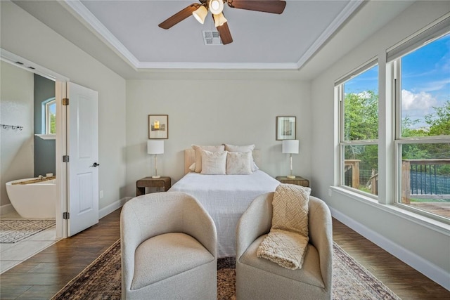 1621 Angolo, New Braunfels, TX 78132 - bedroom featuring a raised ceiling, dark wood-style flooring, ceiling fan, and crown molding
