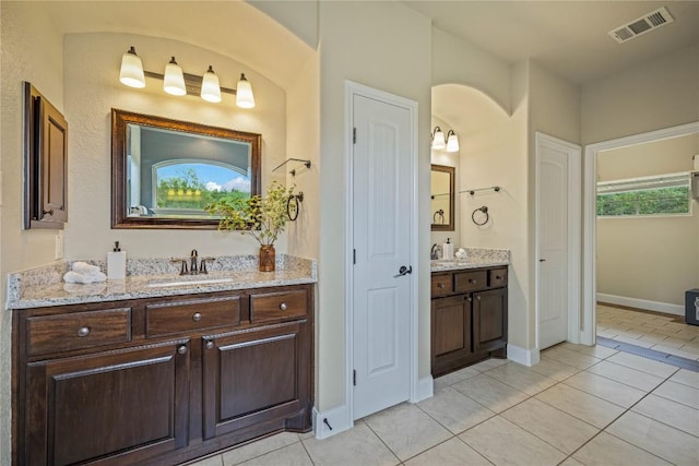 1621 Angolo, New Braunfels, TX 78132 - bathroom featuring two vanities and tile patterned floors