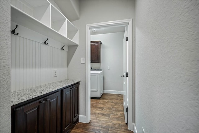 1621 Angolo, New Braunfels, TX 78132 - mudroom featuring washer / dryer, dark wood-type flooring, and a textured wall
