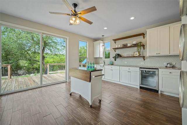 1621 Angolo, New Braunfels, TX 78132 - kitchen with beverage cooler, a ceiling fan, tasteful backsplash, open shelves, and white cabinetry