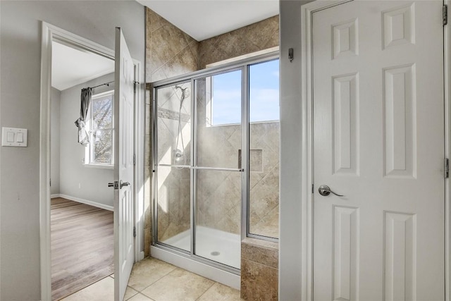 512 Eberhart Ln Unit 1207, Austin, TX 78745 - bathroom featuring plenty of natural light, a stall shower, and tile patterned floors