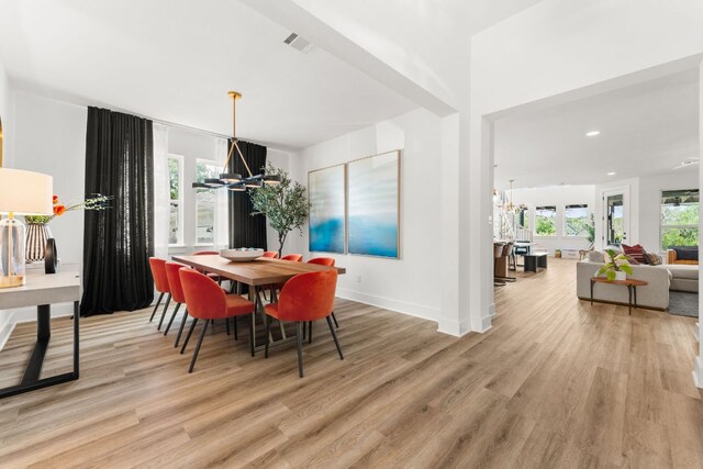 518 Toyah Dr, Dripping Springs, TX 78620 - dining space with a chandelier, wood finished floors, healthy amount of natural light, and recessed lighting