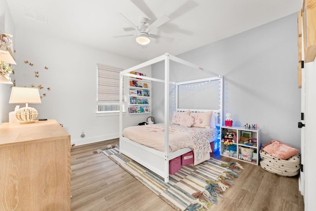 518 Toyah Dr, Dripping Springs, TX 78620 - bedroom with wood finished floors and a ceiling fan