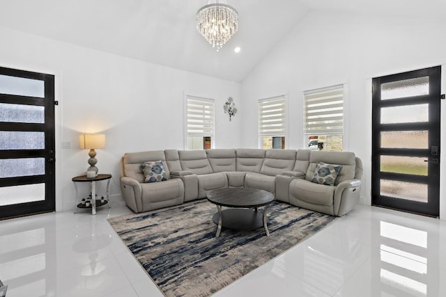 123 Zacate St, Elgin, TX 78621 - living room with a chandelier, tile patterned floors, high vaulted ceiling, and recessed lighting