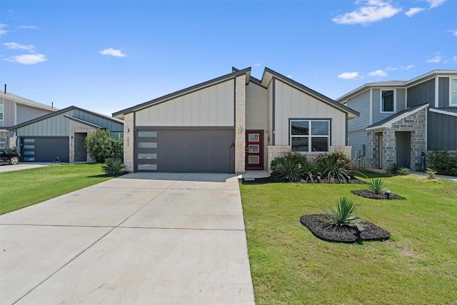 253 Centuryplant Rd, Leander, TX 78641 - view of front of house with an attached garage, a front yard, driveway, board and batten siding, and stone siding