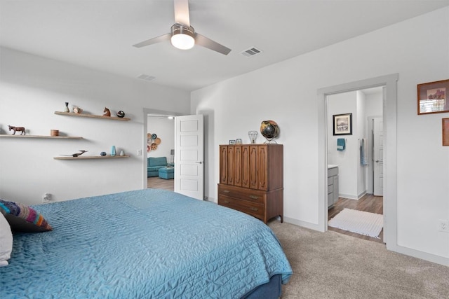 253 Centuryplant Rd, Leander, TX 78641 - carpeted bedroom featuring a ceiling fan and ensuite bath