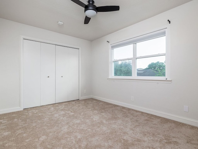 10310 Holme Lacey Ln, Austin, TX 78750 - unfurnished bedroom featuring carpet, a closet, and a ceiling fan