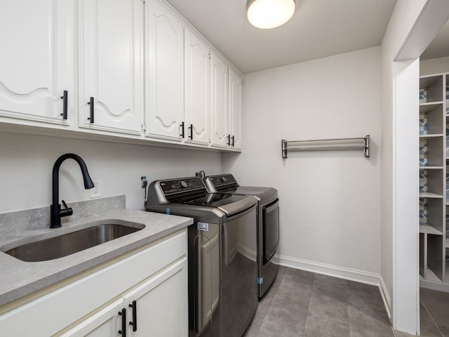 10310 Holme Lacey Ln, Austin, TX 78750 - laundry area with washer and dryer and cabinet space