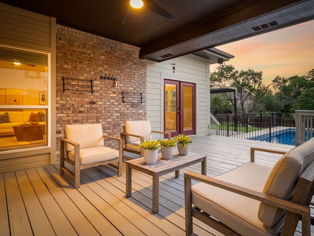10310 Holme Lacey Ln, Austin, TX 78750 - deck at dusk with a ceiling fan, french doors, and an outdoor living space