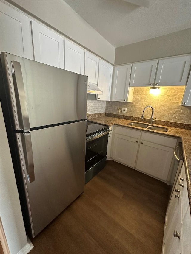 1210 Hi Stirrup Unit 201, Horseshoe Bay, TX 78657 - kitchen with appliances with stainless steel finishes, dark wood-style floors, white cabinetry, under cabinet range hood, and backsplash