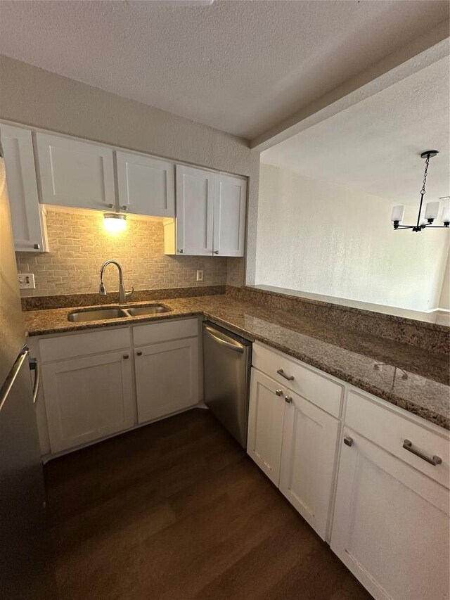 1210 Hi Stirrup Unit 201, Horseshoe Bay, TX 78657 - kitchen with dishwasher, dark wood-style flooring, white cabinets, dark stone countertops, and a textured ceiling