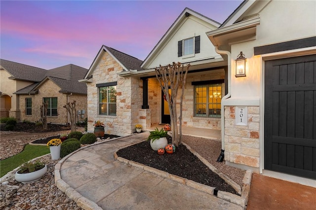 201 Glenfiddich Ln, Austin, TX 78738 - property entrance featuring stone siding, stucco siding, and a porch