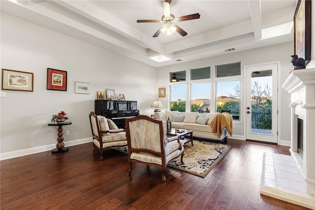 201 Glenfiddich Ln, Austin, TX 78738 - living area featuring ceiling fan, a fireplace, beamed ceiling, and dark wood-style floors