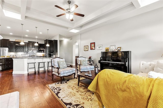 201 Glenfiddich Ln, Austin, TX 78738 - living room with arched walkways, ceiling fan, dark wood finished floors, recessed lighting, and beamed ceiling
