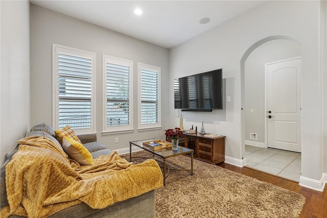 201 Glenfiddich Ln, Austin, TX 78738 - living room with arched walkways, wood finished floors, and recessed lighting