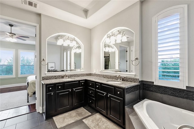 201 Glenfiddich Ln, Austin, TX 78738 - ensuite bathroom with a garden tub, tile patterned flooring, double vanity, and ceiling fan