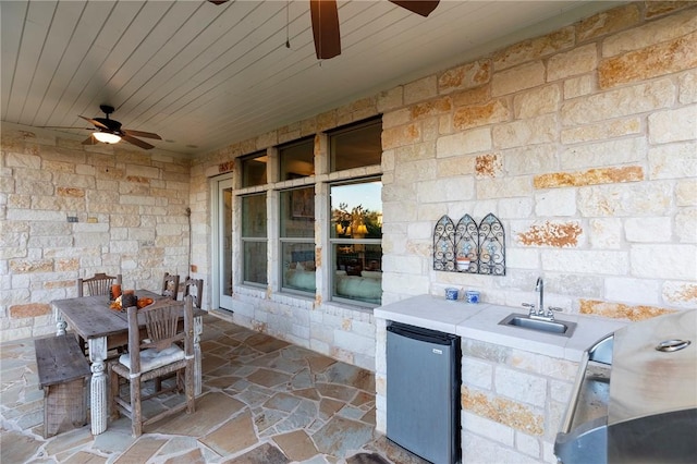 201 Glenfiddich Ln, Austin, TX 78738 - view of patio / terrace featuring ceiling fan, exterior kitchen, and outdoor dining space