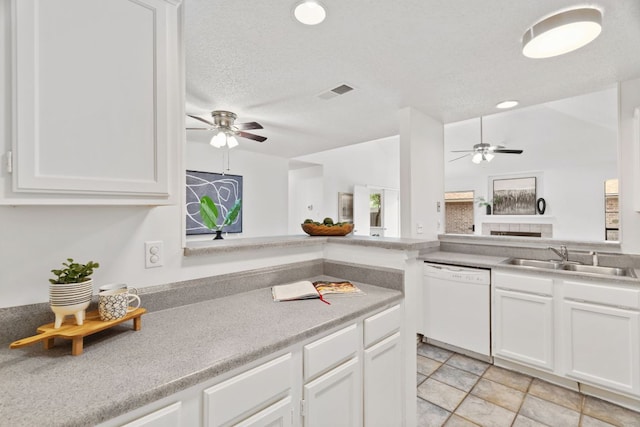 800 Saunders Dr, Round Rock, TX 78664 - kitchen with white dishwasher, ceiling fan, white cabinets, and recessed lighting