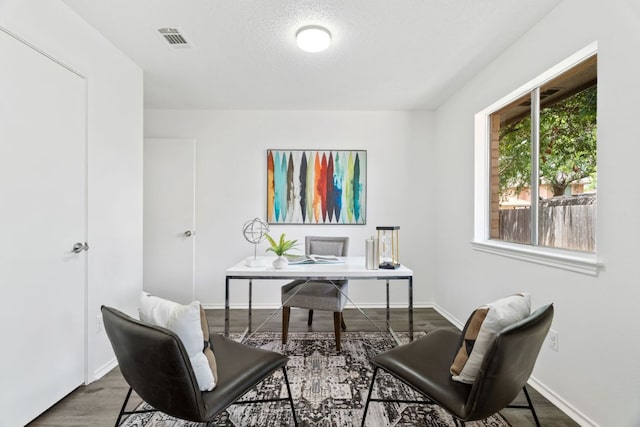 800 Saunders Dr, Round Rock, TX 78664 - office area with wood finished floors and a textured ceiling