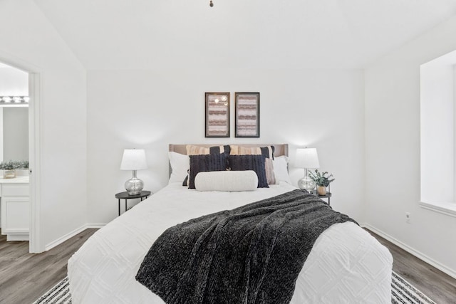 800 Saunders Dr, Round Rock, TX 78664 - bedroom featuring wood finished floors and ensuite bathroom