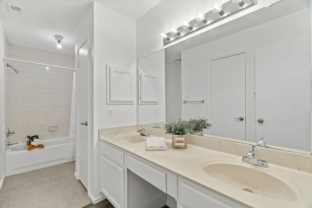 800 Saunders Dr, Round Rock, TX 78664 - bathroom with double vanity, shower / bath combo, and tile patterned flooring