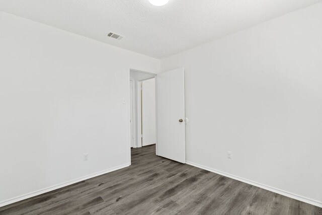 800 Saunders Dr, Round Rock, TX 78664 - spare room with wood finished floors and baseboards