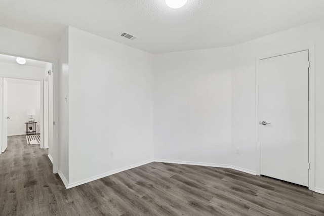 800 Saunders Dr, Round Rock, TX 78664 - unfurnished room featuring wood finished floors and a textured ceiling
