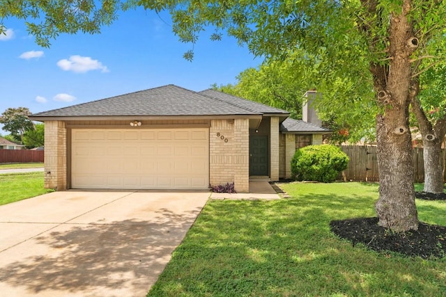 800 Saunders Dr, Round Rock, TX 78664 - view of front of property featuring brick siding, concrete driveway, an attached garage, a chimney, and a shingled roof