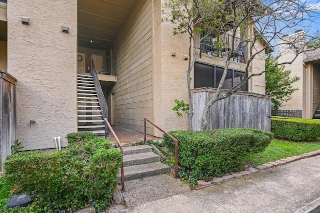 1202 Thorpe Ln Unit 407, San Marcos, TX 78666 - entrance to property with stucco siding and a balcony