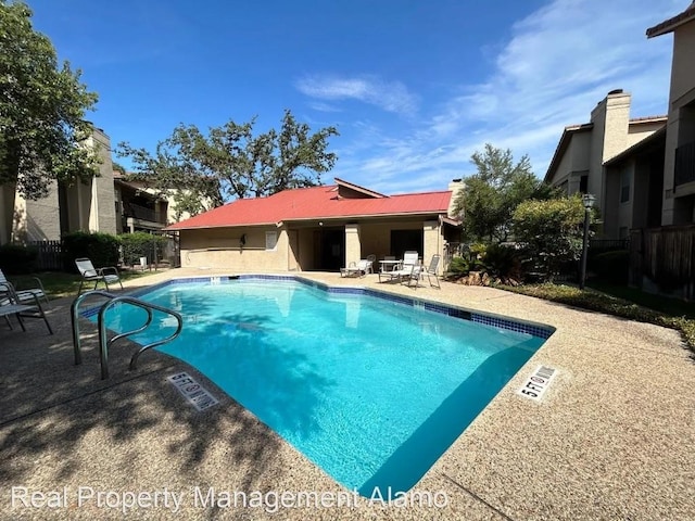 1202 Thorpe Ln Unit 407, San Marcos, TX 78666 - community pool featuring a patio area