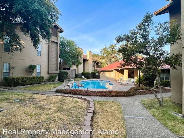 1202 Thorpe Ln Unit 407, San Marcos, TX 78666 - outdoor pool featuring a patio