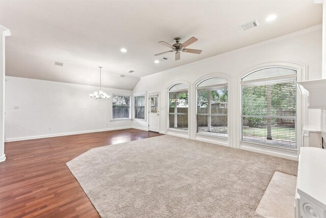 4306 S Summercrest Loop, Round Rock, TX 78681 - unfurnished living room with a ceiling fan, a chandelier, lofted ceiling, wood finished floors, and recessed lighting