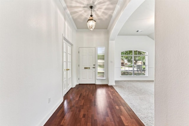 4306 S Summercrest Loop, Round Rock, TX 78681 - entryway with arched walkways, dark wood-style floors, and ornamental molding