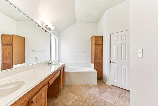 4306 S Summercrest Loop, Round Rock, TX 78681 - bathroom with vaulted ceiling, a bath, and double vanity