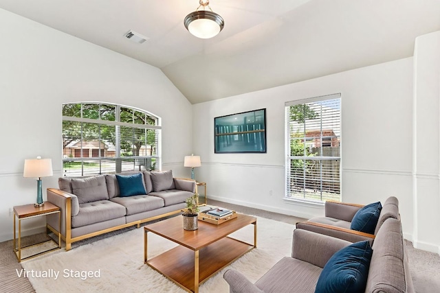 4306 S Summercrest Loop, Round Rock, TX 78681 - living room featuring plenty of natural light, carpet floors, and vaulted ceiling