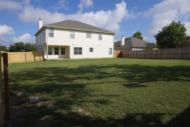 18801 Edinburgh Castle Rd, Pflugerville, TX 78660 - back of house with a chimney and a fenced backyard