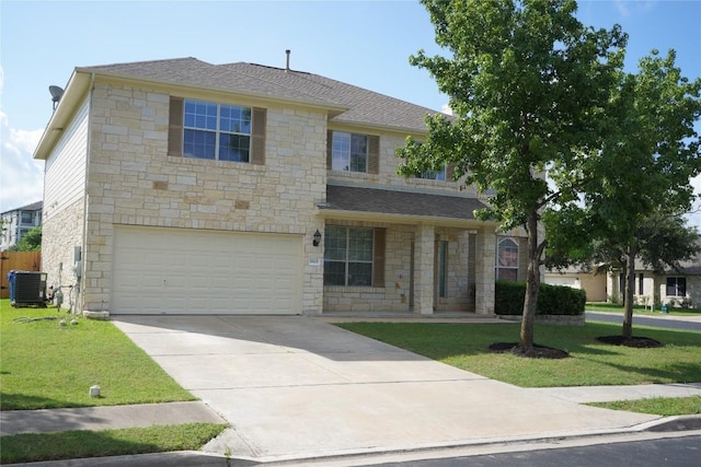 18801 Edinburgh Castle Rd, Pflugerville, TX 78660 - view of front facade featuring stone siding, a garage, a front lawn, and driveway