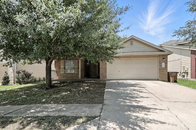 12613 Paloma Blanca Way, Del Valle, TX 78617 - view of front of property with brick siding, an attached garage, and concrete driveway