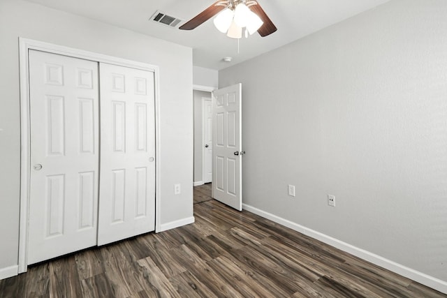 12613 Paloma Blanca Way, Del Valle, TX 78617 - unfurnished bedroom with dark wood-type flooring, a closet, and ceiling fan