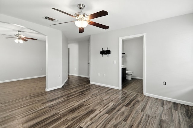 12613 Paloma Blanca Way, Del Valle, TX 78617 - unfurnished room featuring ceiling fan and dark wood finished floors
