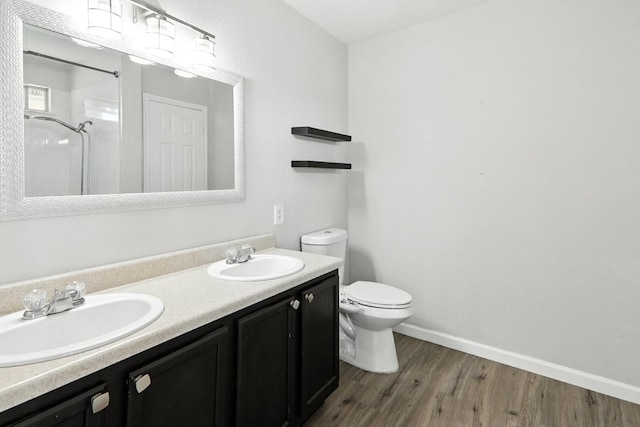 12613 Paloma Blanca Way, Del Valle, TX 78617 - bathroom featuring a shower, double vanity, and wood finished floors