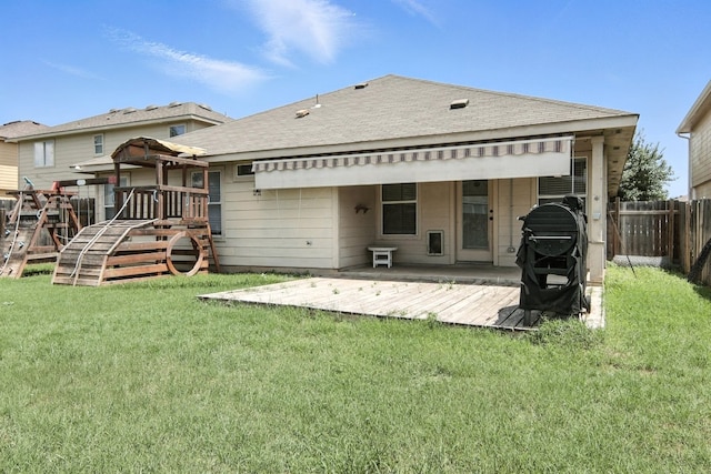 12613 Paloma Blanca Way, Del Valle, TX 78617 - back of house with a deck and a shingled roof