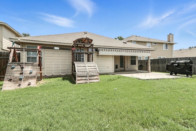 12613 Paloma Blanca Way, Del Valle, TX 78617 - back of house with a patio area and a fenced backyard