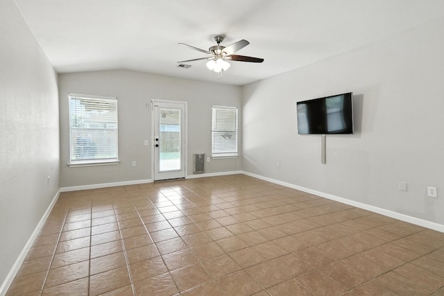 12613 Paloma Blanca Way, Del Valle, TX 78617 - empty room featuring ceiling fan, tile patterned floors, and vaulted ceiling