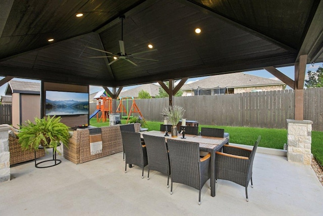 5106 La Piedra Ln, Killeen, TX 76549 - fenced backyard with a patio, a playground, a ceiling fan, and outdoor dining area